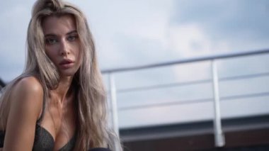 This stock video shows a beautiful girl in sexy erotic lingerie, slow motion