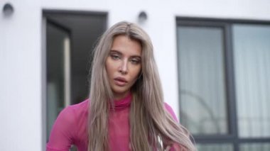 This stock video shows a beautiful girl in sexy erotic lingerie, slow motion