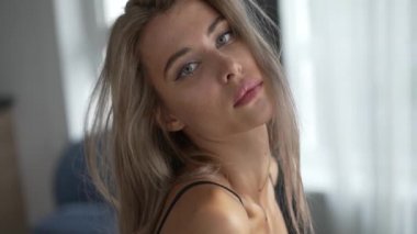 This stock video shows a beautiful girl in sexy erotic lingerie, slow motion