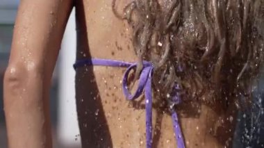 This stock slow motion video shows a sexy woman taking a shower