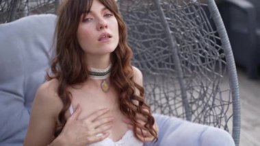 This is a stock video shows a girl in beautiful erotic sexy lingerie