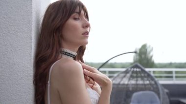 This is a stock video shows a girl in beautiful erotic sexy lingerie