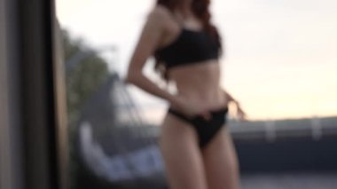 This is a stock video shows a girl in beautiful erotic sexy lingerie