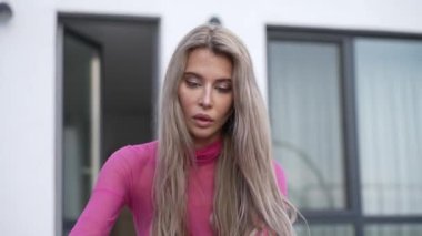 This stock video shows a beautiful woman in sexy lingerie, slow motion