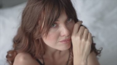 This stock video shows a beautiful woman in sexy lingerie, slow motion in 8K resolution