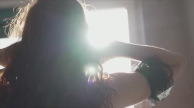 This stock video shows a beautiful woman in sexy lingerie, slow motion in 8K resolution