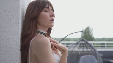 This stock video shows a beautiful woman in sexy lingerie, slow motion in 8K resolution