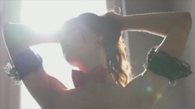 This stock video shows a beautiful woman in sexy lingerie, slow motion in 8K resolution