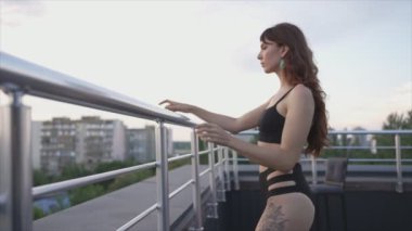 This stock video shows a beautiful woman in sexy lingerie, slow motion in 8K resolution