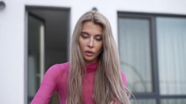 This stock video shows a beautiful woman in sexy lingerie, slow motion