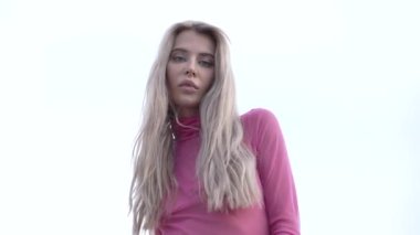 This stock video shows a beautiful woman in sexy lingerie, slow motion