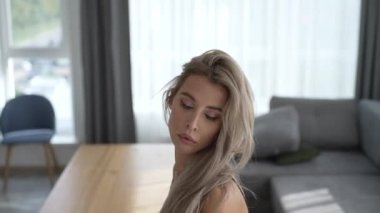 This stock video shows a beautiful woman in sexy lingerie, slow motion