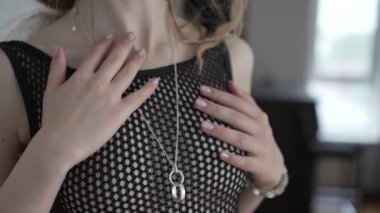 This stock video shows a beautiful girl in sexy lingerie, slow motion