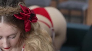 This stock video shows a beautiful woman in sexy lingerie, slow motion