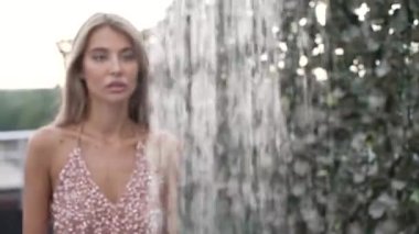 This stock slow motion video shows a sexy woman taking a shower