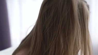 This stock video shows a girl in erotic sexy lingerie, slow motion