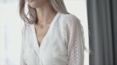 This is a stock video shows a girl in beautiful erotic sexy lingerie in 8K resolution