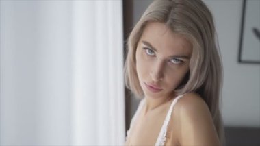 This is a stock video shows a girl in beautiful erotic sexy lingerie in 8K resolution