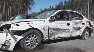 This stock video shows a dump of shot and burned cars in Irpin, Bucha district in 8K resolution