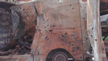 This stock video shows a dump of shot and burned cars in Irpin, Bucha district in 8K resolution