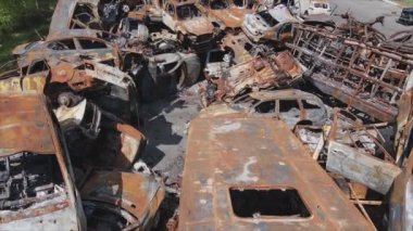 This stock video shows a dump of shot and burned cars in Irpin, Bucha district in 8K resolution