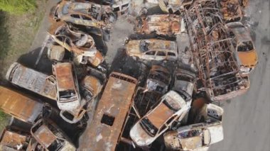 This stock video shows a dump of shot and burned cars in Irpin, Bucha district in 8K resolution