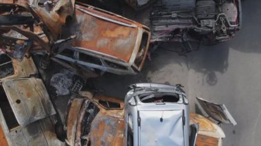 This stock video shows a dump of shot and burned cars in Irpin, Bucha district in 8K resolution