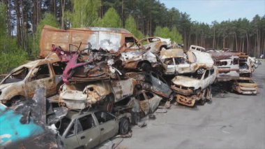 This stock video shows a dump of shot and burned cars in Irpin, Bucha district in 8K resolution