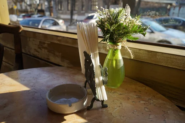 Napkin Holder Ashtray Bouquet Flowers Cafe Table — Stock Photo, Image