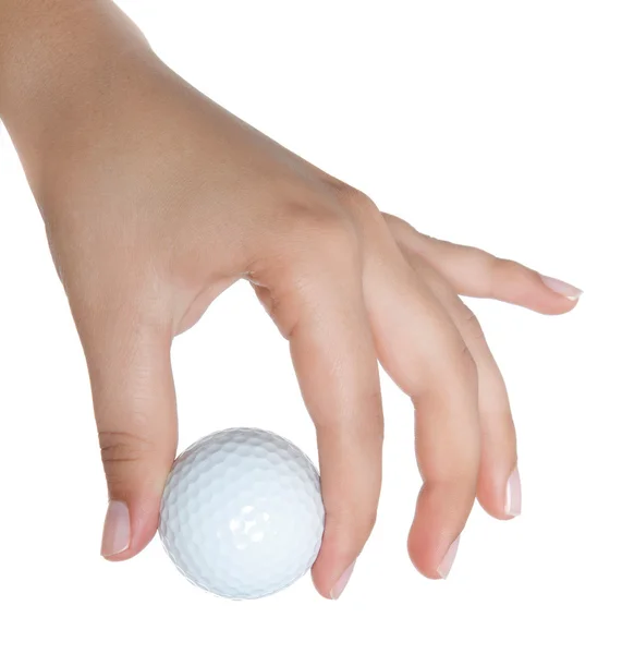 Golfboll håll av en kvinna hand — Stockfoto