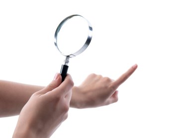 Hand holding magnifying glass isolated on white background clipart