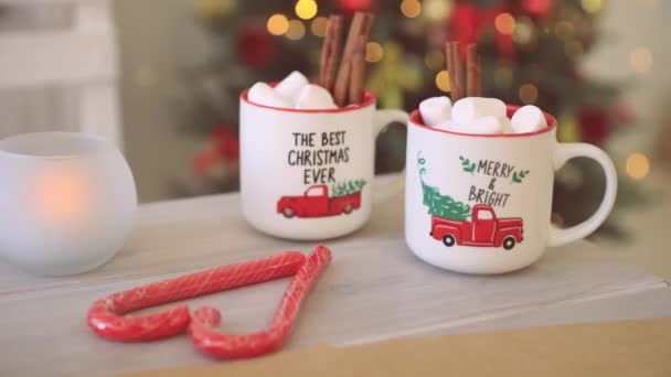 Christmas Mugs Hot Coffee Marshmallows Background Christmas Lights — Stockvideo