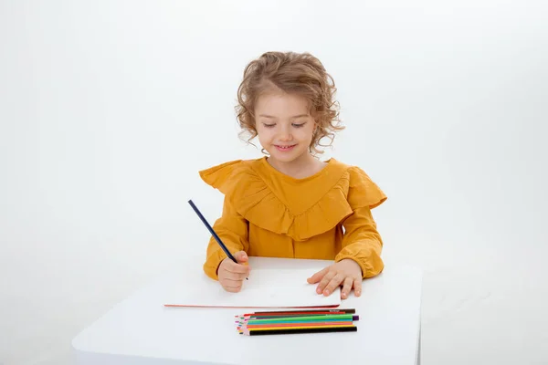 Little Cute Kid Drawing Table Pencils Isolated White Background — Stock Photo, Image