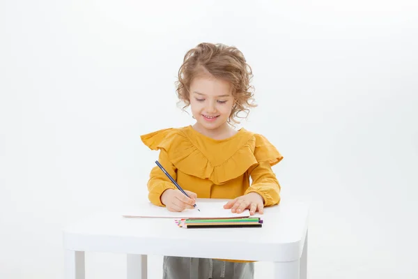 Little Cute Kid Drawing Table Pencils Isolated White Background Stockfoto