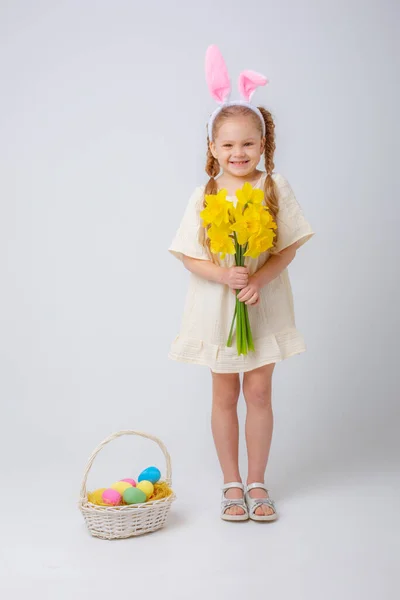 Cute Little Girl Bunny Ears Holds Bouquet Yellow Daffodil Flowers — Stockfoto