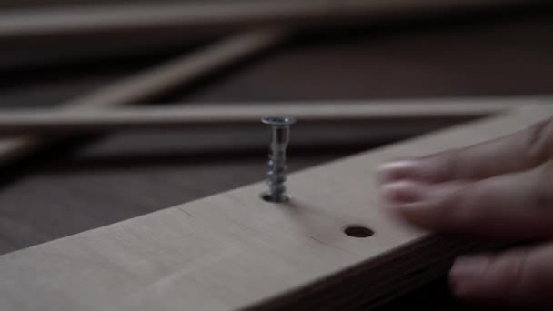 Close Up Hand Young Man Drives Screws Lays Out Parts Of Bookcase On Floor For Assembly Rack Furniture At Home. Collecting Wooden Boards On Living Room House. Moving At New Place. Guy Making Renovation — Stockvideo