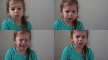 Video kolajlı küçük kız üzgün bebek ağlayarak hıçkıra hıçkıra ağladı. Samimi çocuk duyguları evde ağlayan güzel yüzlü bir çocuk gibi. Çocukluk hakaretini kabul et Kederi rencide et