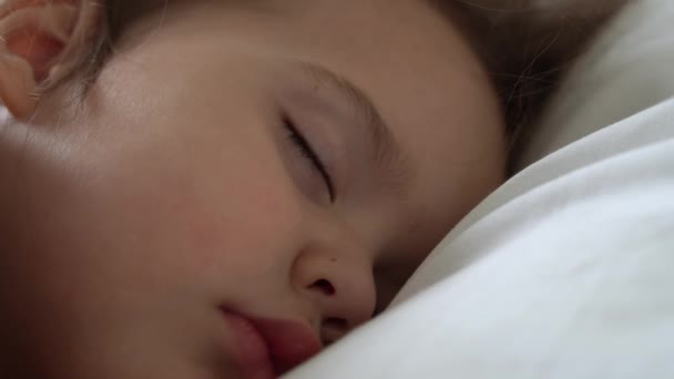 Authentic Cute Little Girl Sleeping Sweetly In Comfortable White and Grey Bed Close Up. Beautiful Tired Child Have Rest Time Gently Soothing. Kid in Crib. Care, Childhood, Parenthood, Life concept — Stock Video © mytrykau  