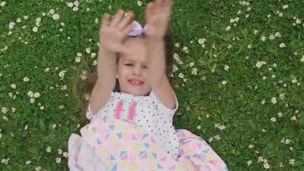 Little Happy Child Girl Dress Bow Head Laying Green Lawn — Stock Video