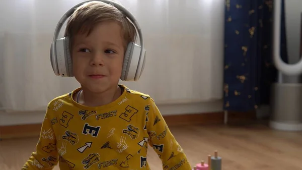 Close Handsome Smiling Boy Listening Music Headphones Indoor Children Technology — Stock Photo, Image