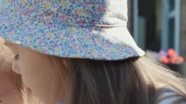 Close up portrait Girl enjoys delicious ice cream cone. Child eating watermelon popsicle. Kid Sibling snack sweets in Home Garden. Summer holiday Hot weather Sunny Day. Childhood, Food Candy Friends.