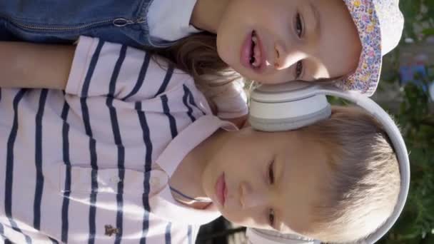 Vertical Cute Little Three Children Headphones Listening Music Cheerful Carefree — Vídeo de Stock