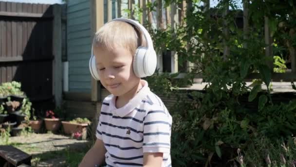 Portrait Cute Little Boy Headphones Listening Music Cheerful Carefree Childhood — Vídeo de Stock