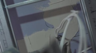 Hard male work on construction site. professional worker in special uniforms Contractors Safety Hats repairing ceiling wall inside building. Builders equipment at workplace. industrial premises