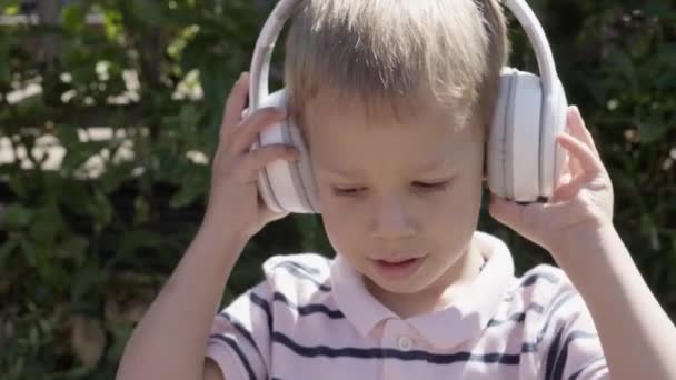 Portrait Cute Little Boy Headphones Listening Music Cheerful Carefree Childhood — Stock Video