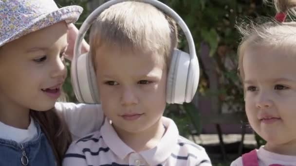 Portrait Cute Little Three Children Headphones Listening Music Cheerful Carefree — Stockvideo