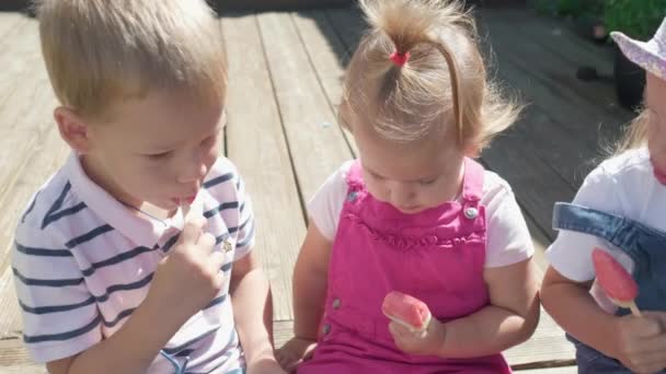 Three Cute Little Children Enjoys Delicious Ice Cream Cone Child — Video