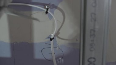 Hard male work on construction site. professional worker in special uniforms Contractors Safety Hats repairing ceiling wall inside building. Builders equipment at workplace. industrial premises.