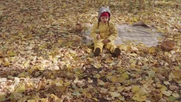Small Cheerful Preschool Child Girl Warm Red Hat Eats Licks — Vídeo de stock