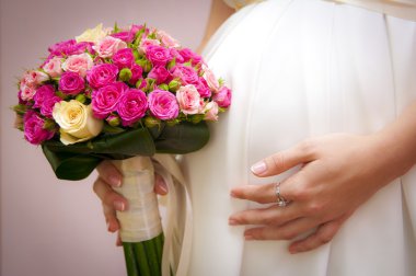 Pregnant bride with a bouquet clipart